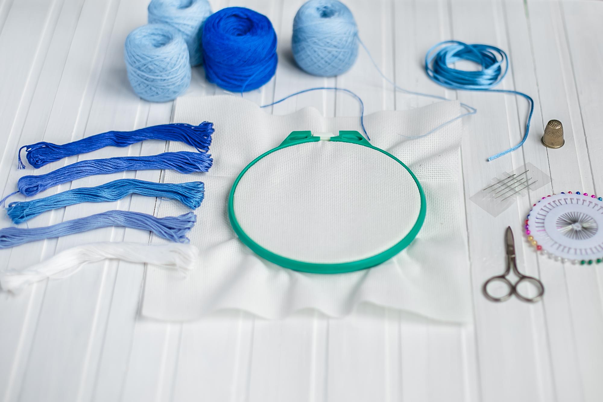 Studio workspace with threads and hoops